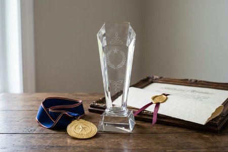 An image of the word accolade as defined by any award, honor, or laudatory notice.