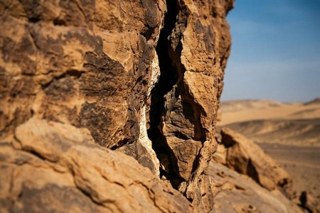An image of the word crevice as defined by a crack forming an opening; cleft; rift; fissure.