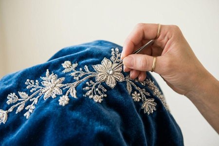 An image of the word embellish as defined by to beautify by or as if by ornamentation; ornament; adorn.
