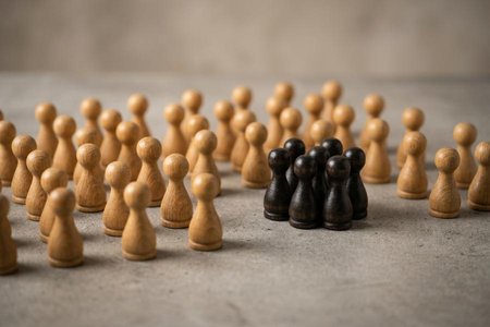 An image of the word faction as defined by a group or clique within a larger group, party, government, organization, or the like, typically having different opinions and interests than the larger group.