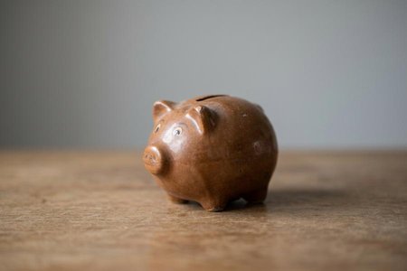 An image of the word frugal as defined by economical in use or expenditure; prudently saving or sparing; not wasteful.