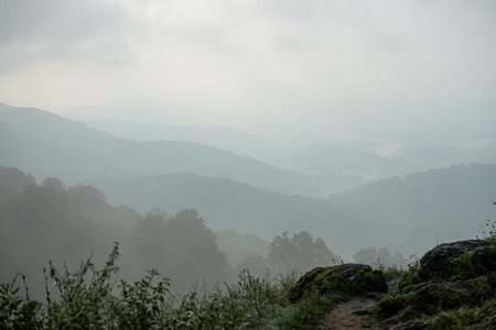 An image of the word hazy as defined by characterized by the presence of haze; misty.