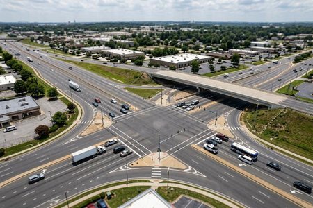 An image of the word intersection as defined by a place where two or more roads meet, especially when at least one is a major highway; junction.
