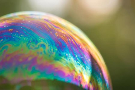 An image of the word iridescent as defined by displaying a play of lustrous colors like those of the rainbow.