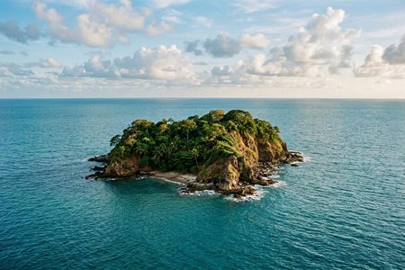 An image of the word island as defined by a tract of land completely surrounded by water, and not large enough to be called a continent.