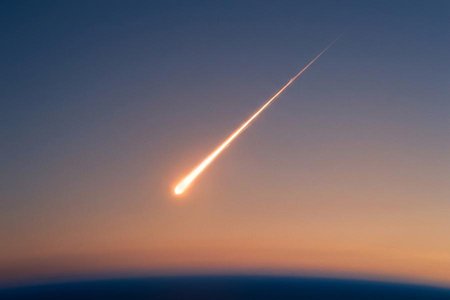An image of the word meteor as defined by a meteoroid that has entered the earth's atmosphere.