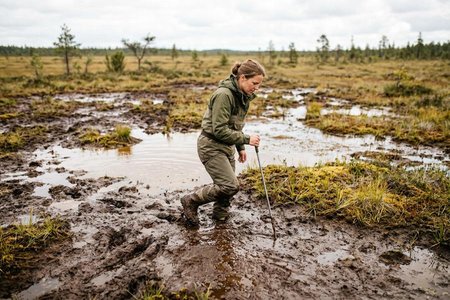 An image of the word mire as defined by a tract or area of wet, swampy ground; bog; marsh.
