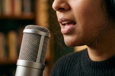 An image of the word narrator as defined by a person who gives an account or tells the story of events, experiences, etc.