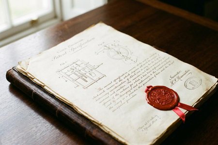 An image of the word patent as defined by the exclusive right granted by a government to an inventor to manufacture, use, or sell an invention for a certain number of years.