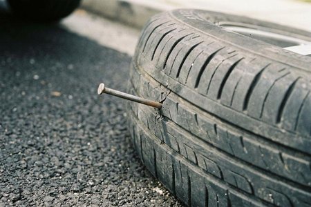 An image of the word puncture as defined by the act of piercing or perforating, as with a pointed instrument or object.