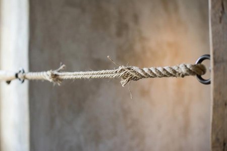 An image of the word tension as defined by the act of stretching or straining.