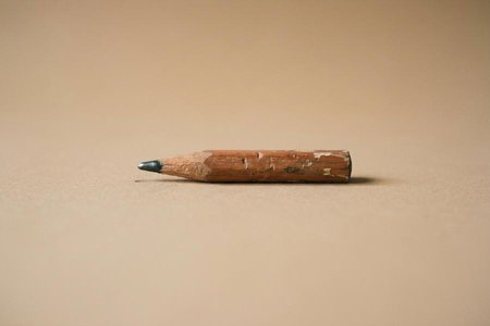 An image of the word wearing as defined by gradually impairing or wasting.
